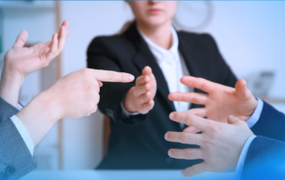 Leader helping navigate workplace conflict between two employees during a dispute.